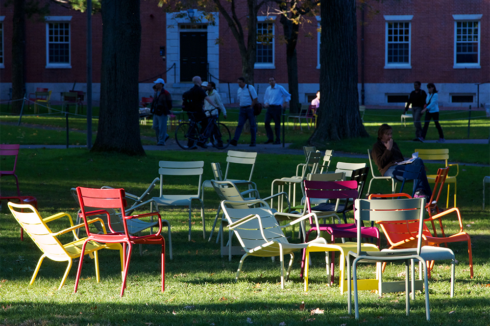 Colourful chairs in the sun in Harvard Yard, the old heart of Harvard University (photograph by Jannis Werner/Alamy)